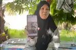 Nurwahyuni-menunjukkan-foto-anaknya-yang-diduga-jadi-korban-penculikan.jpg