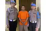 Aipda-JEB-tengah-mengenakan-baju-tahanan-usai-ditangkap.jpg